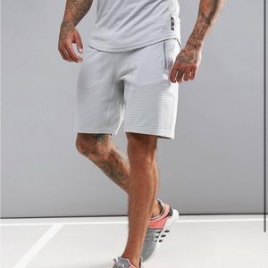 Adidas athletics x reigning champ shorts deals